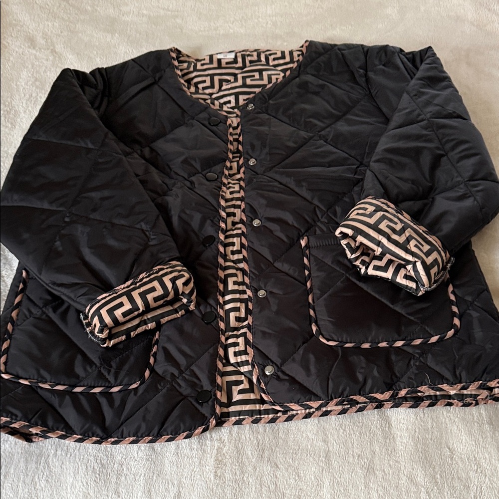 Elegant Black Quilted Jacket with Geometric Trim